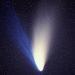 Comet dust tail behind cometary nucleus